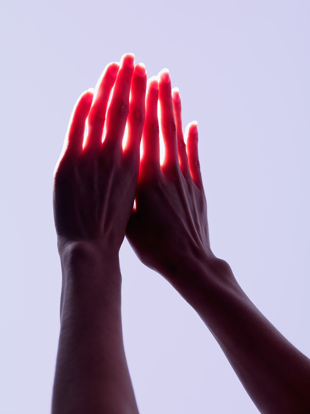 Hands lit from behind