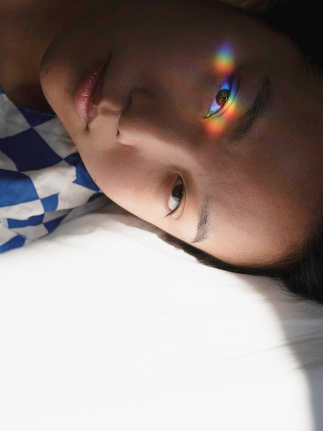 An eye reflecting a spectrum of color
